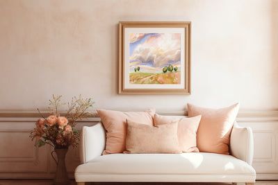 Living room with a white sofa, pink pillows, and a framed painting on the wall.