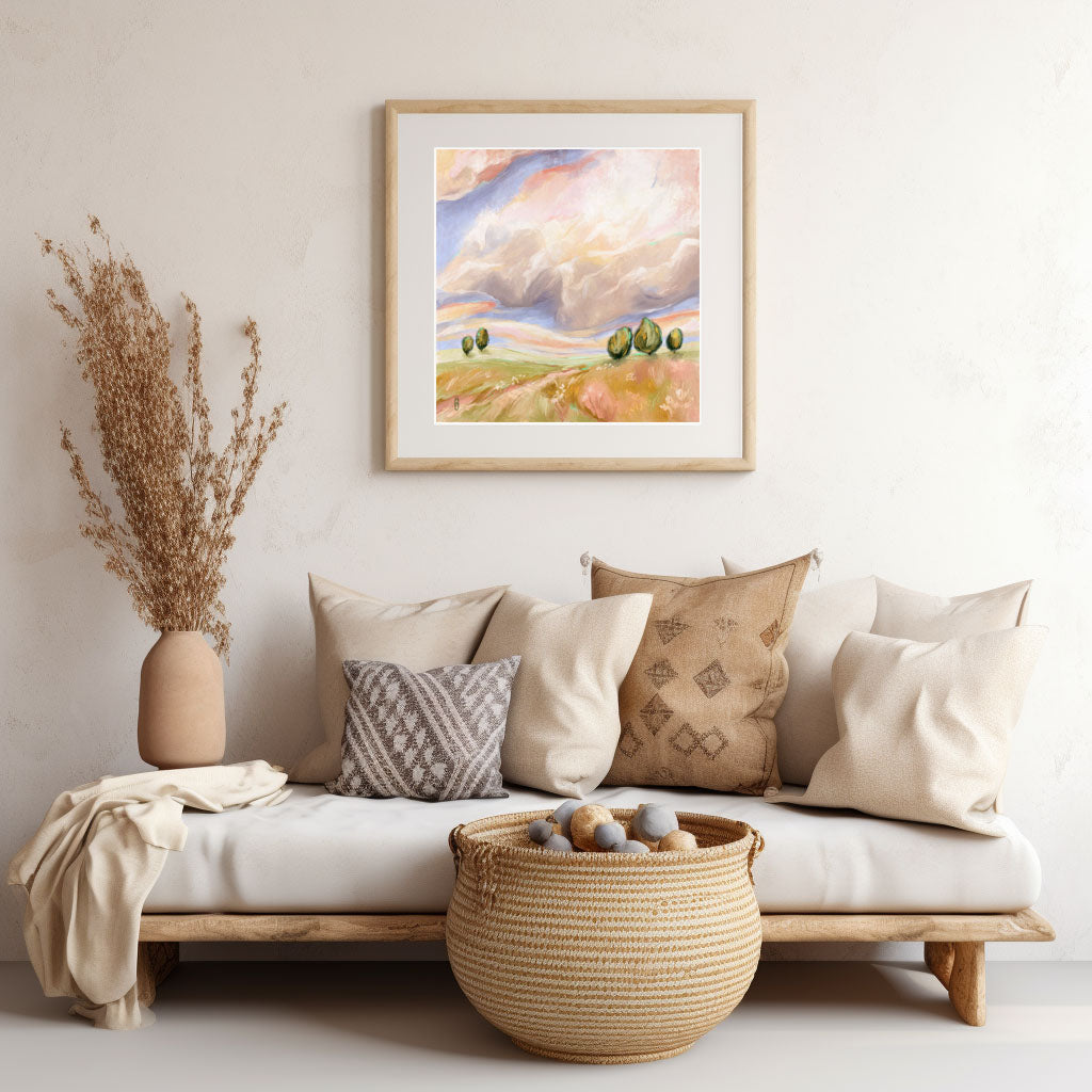 Living room with a sofa, decorative pillows, a woven basket, and a framed painting on the wall.