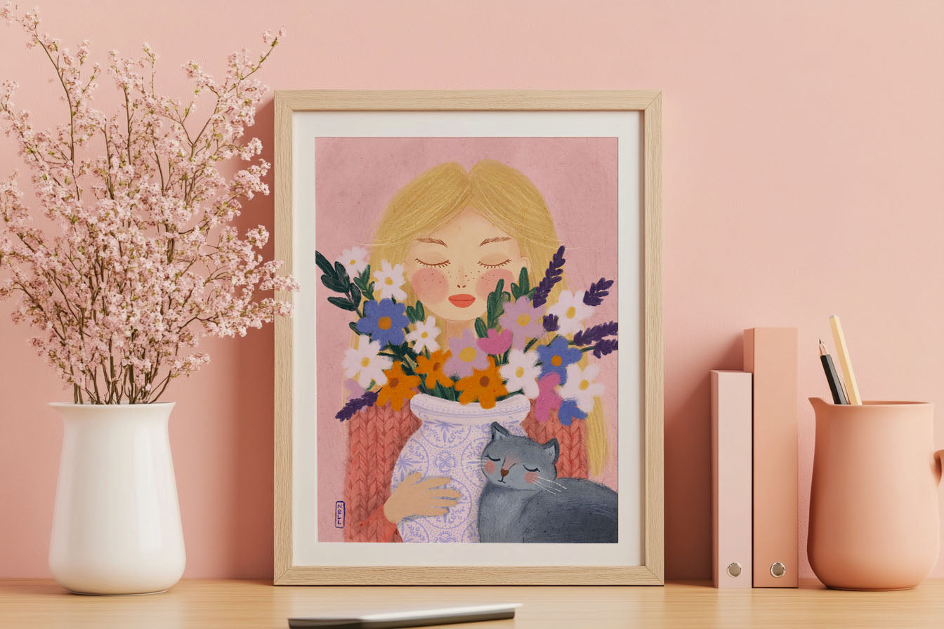 Framed artwork of a woman holding flowers on a desk with decorative items.
