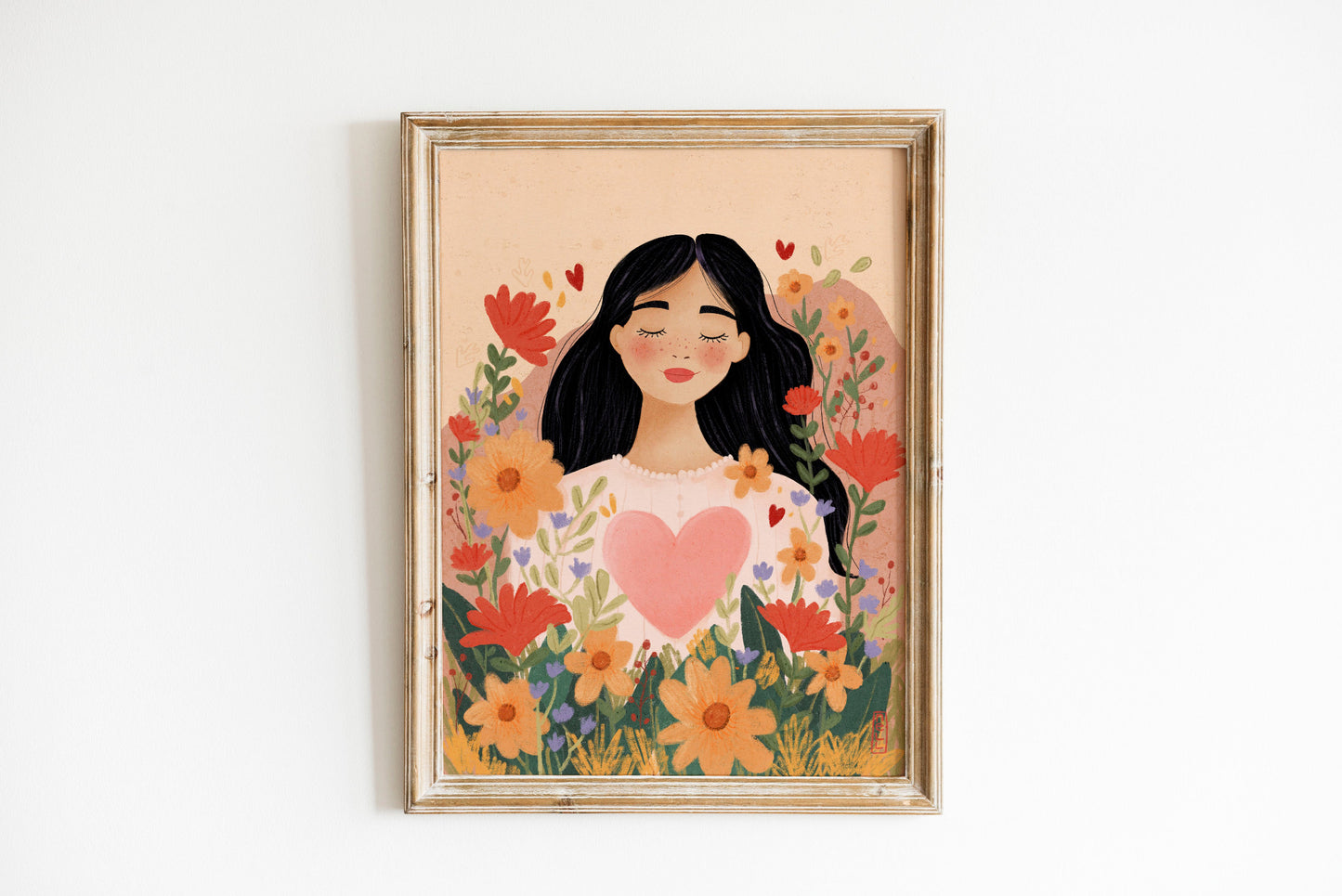 Framed artwork of a woman surrounded by flowers on a beige background
