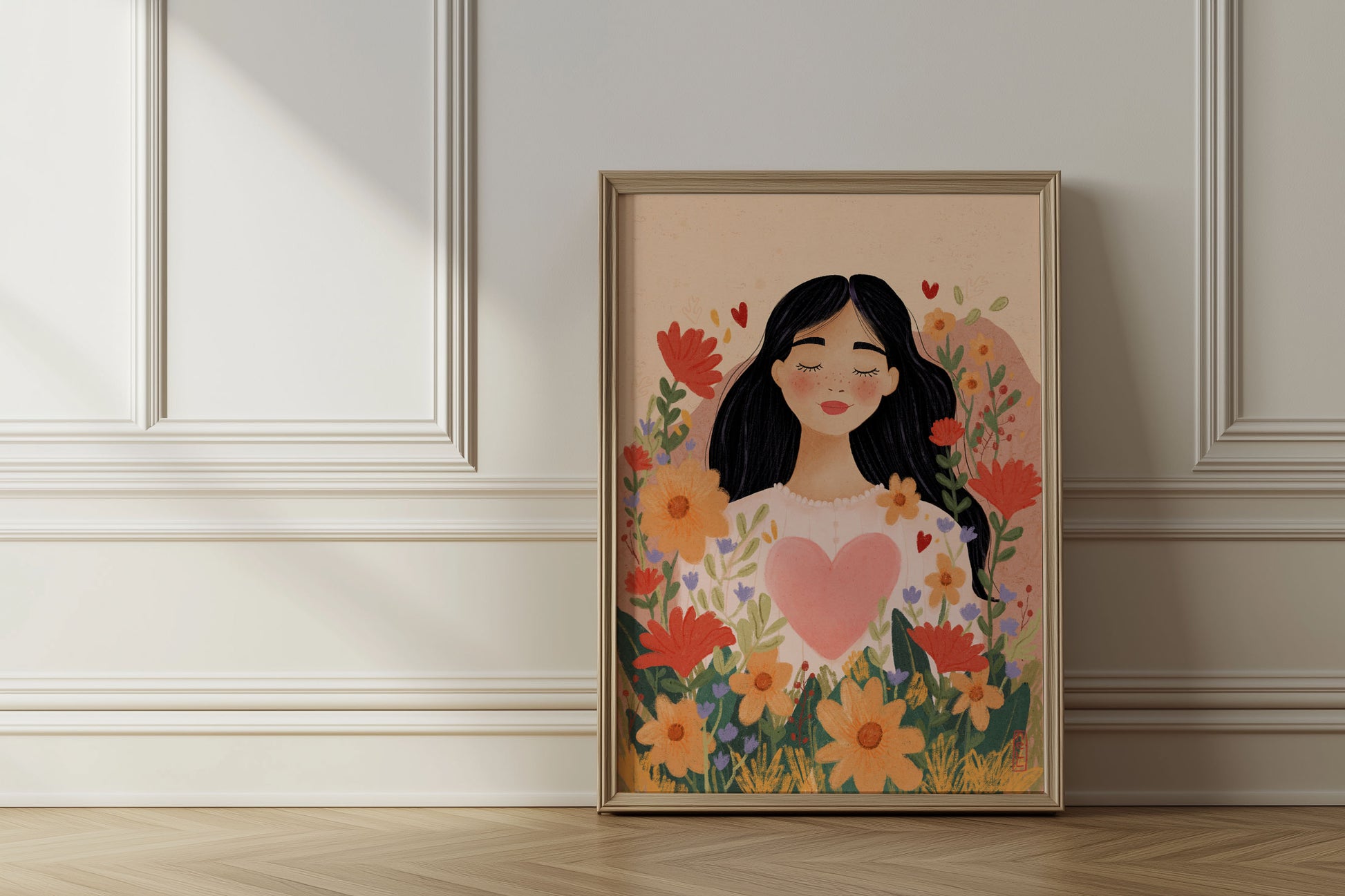 Framed artwork of a woman with flowers and a heart on a wall.