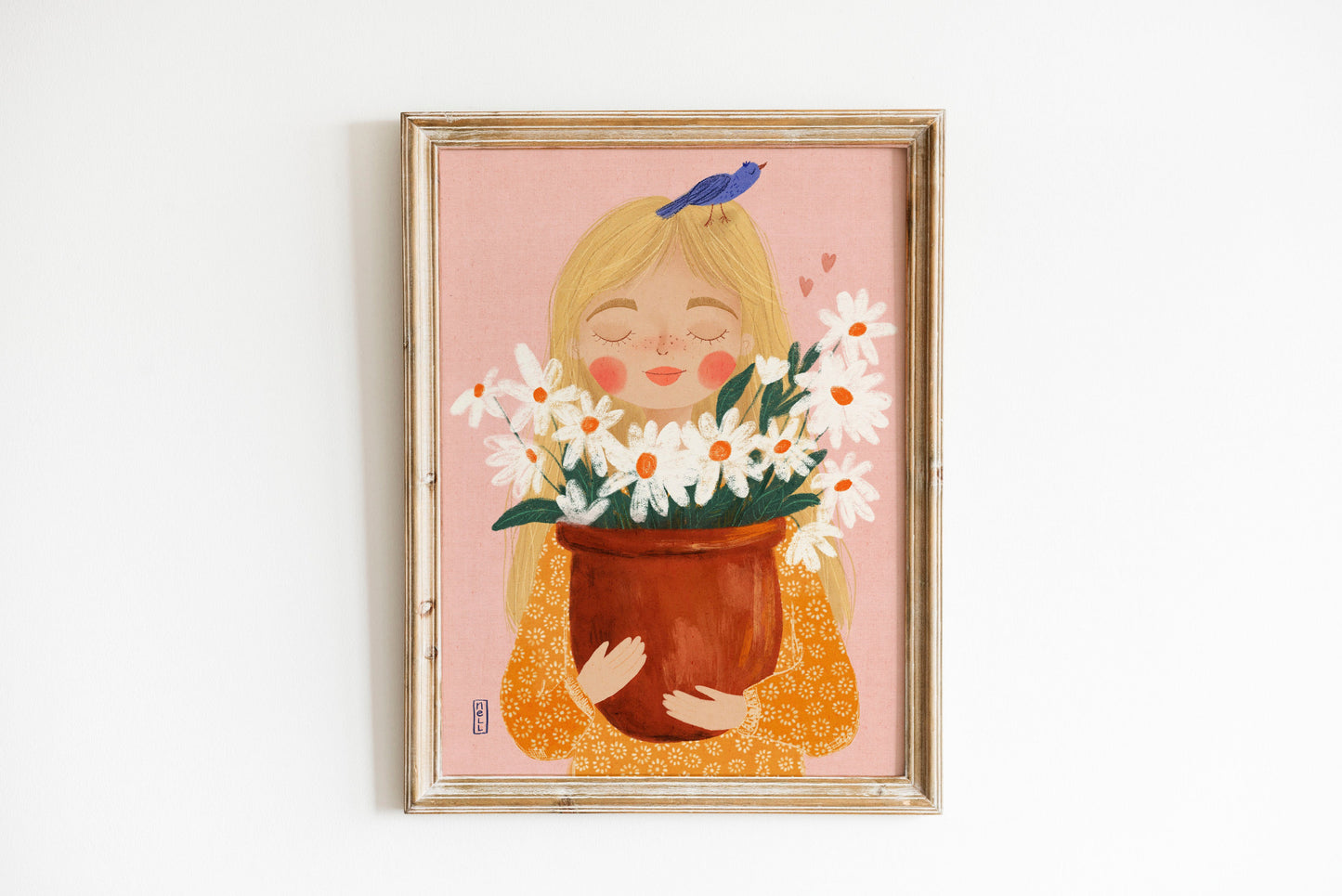 Framed artwork of a girl holding flowers on a pink background