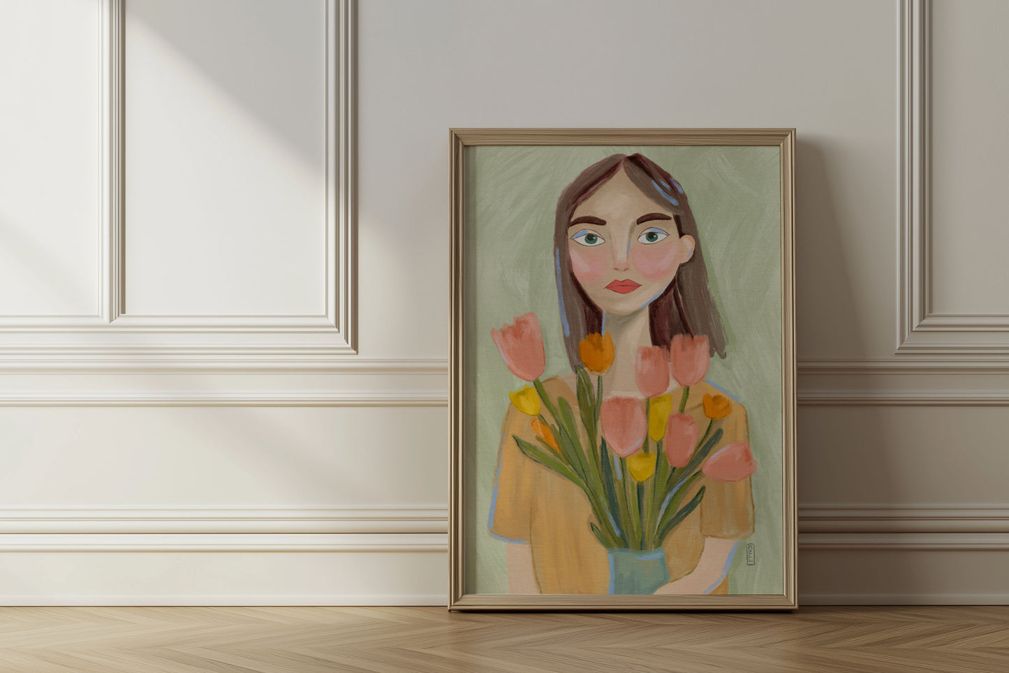Framed artwork of a woman holding flowers on a wall.