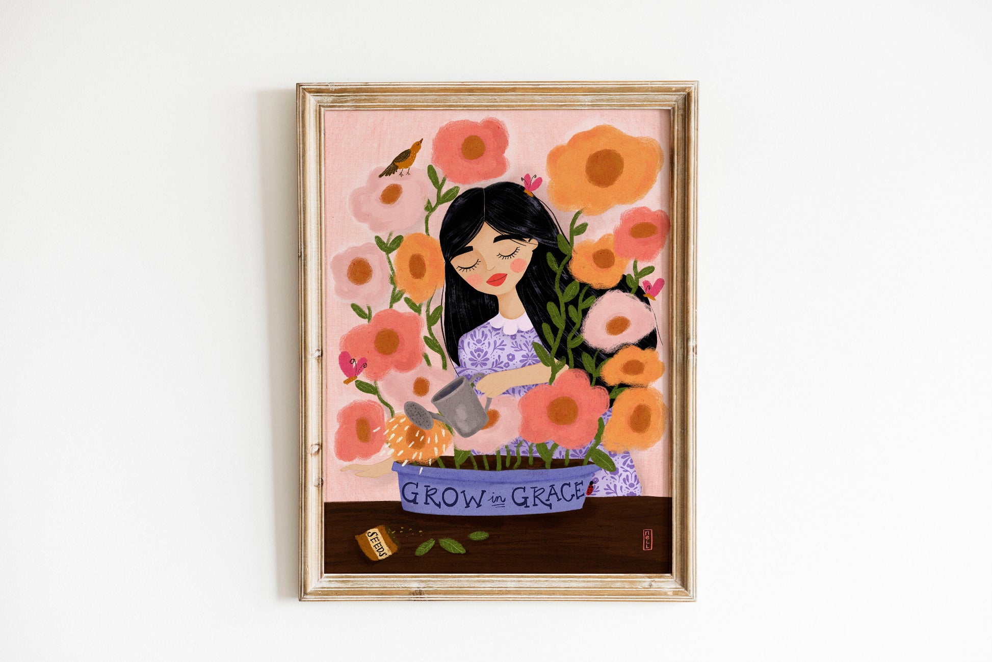 Framed artwork of a woman with flowers and 'Grow in Grace' text on a white background