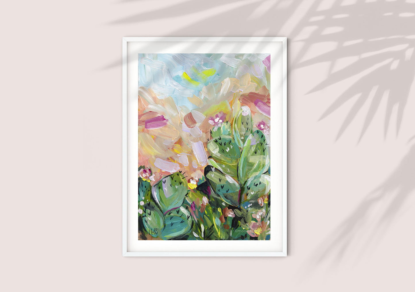 Framed abstract artwork with colorful leaves on a light background