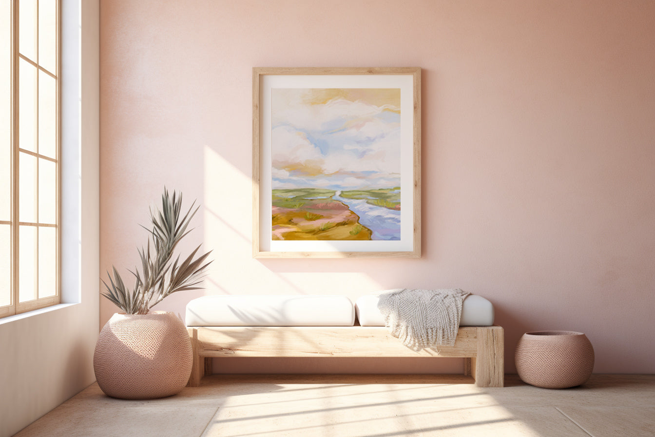 Nest living room with a wooden bench, plant, and framed artwork on a pink wall.