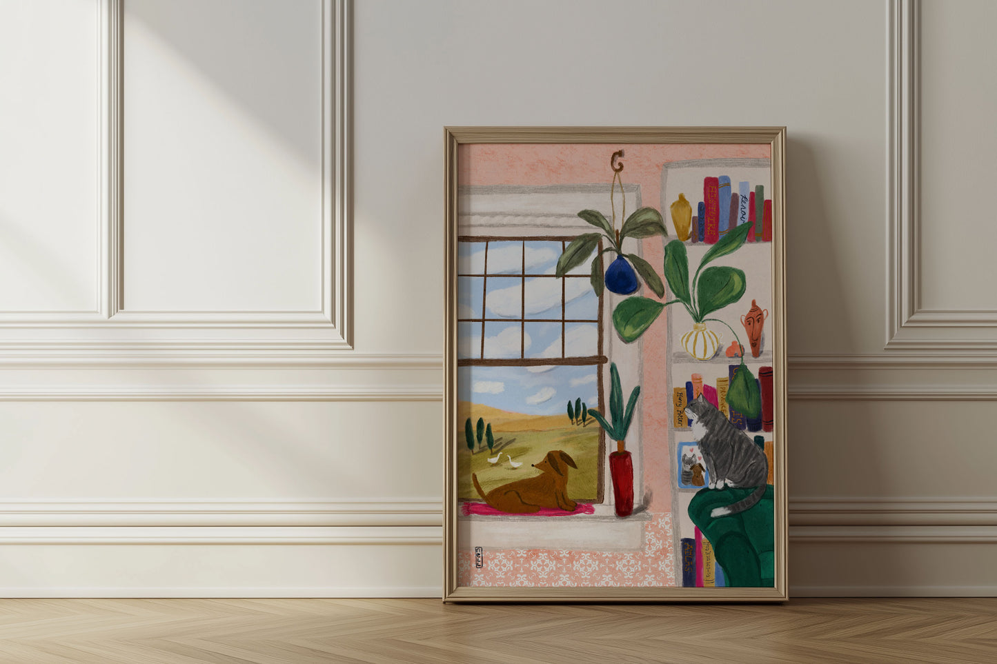 Framed artwork on a wall with a window view and indoor elements.