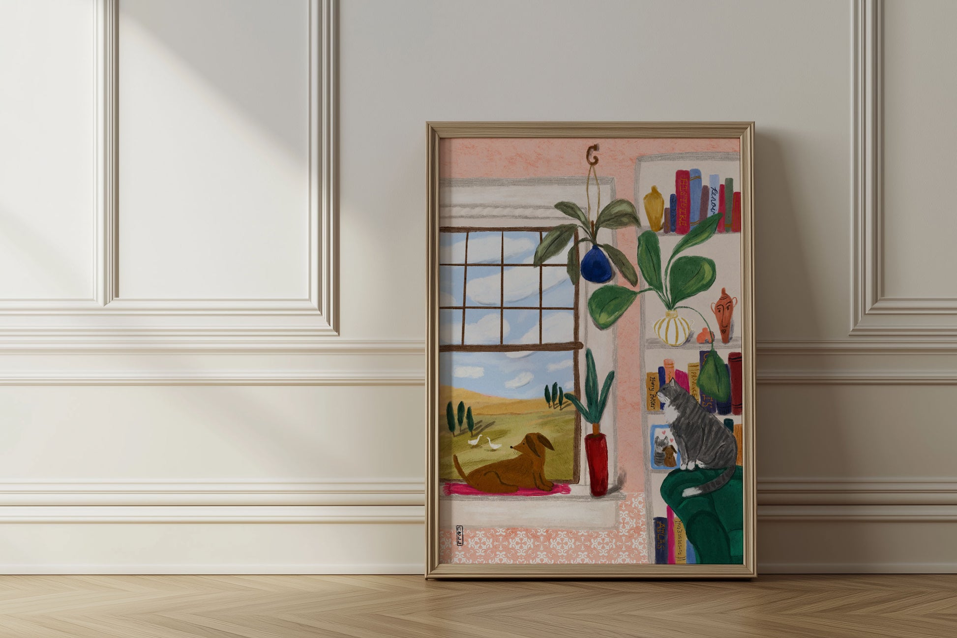 Framed artwork on a wall with a window view and indoor elements.