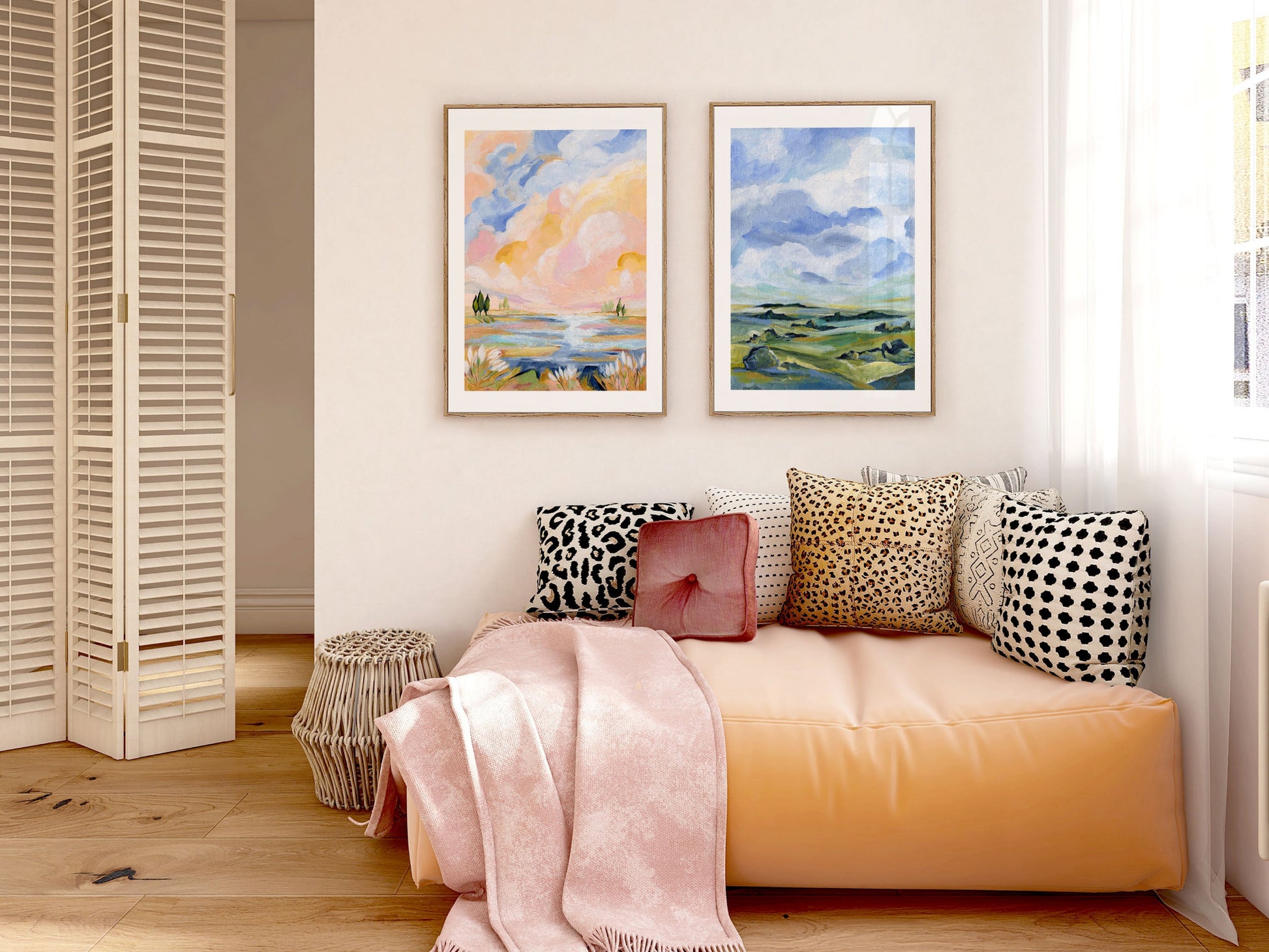 Living room with a peach-colored sofa, decorative pillows, and framed artwork on the wall.