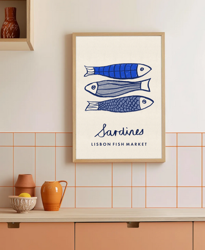 Framed artwork of sardines with 'Sardines Lisbon Fish Market' text on a tiled wall.