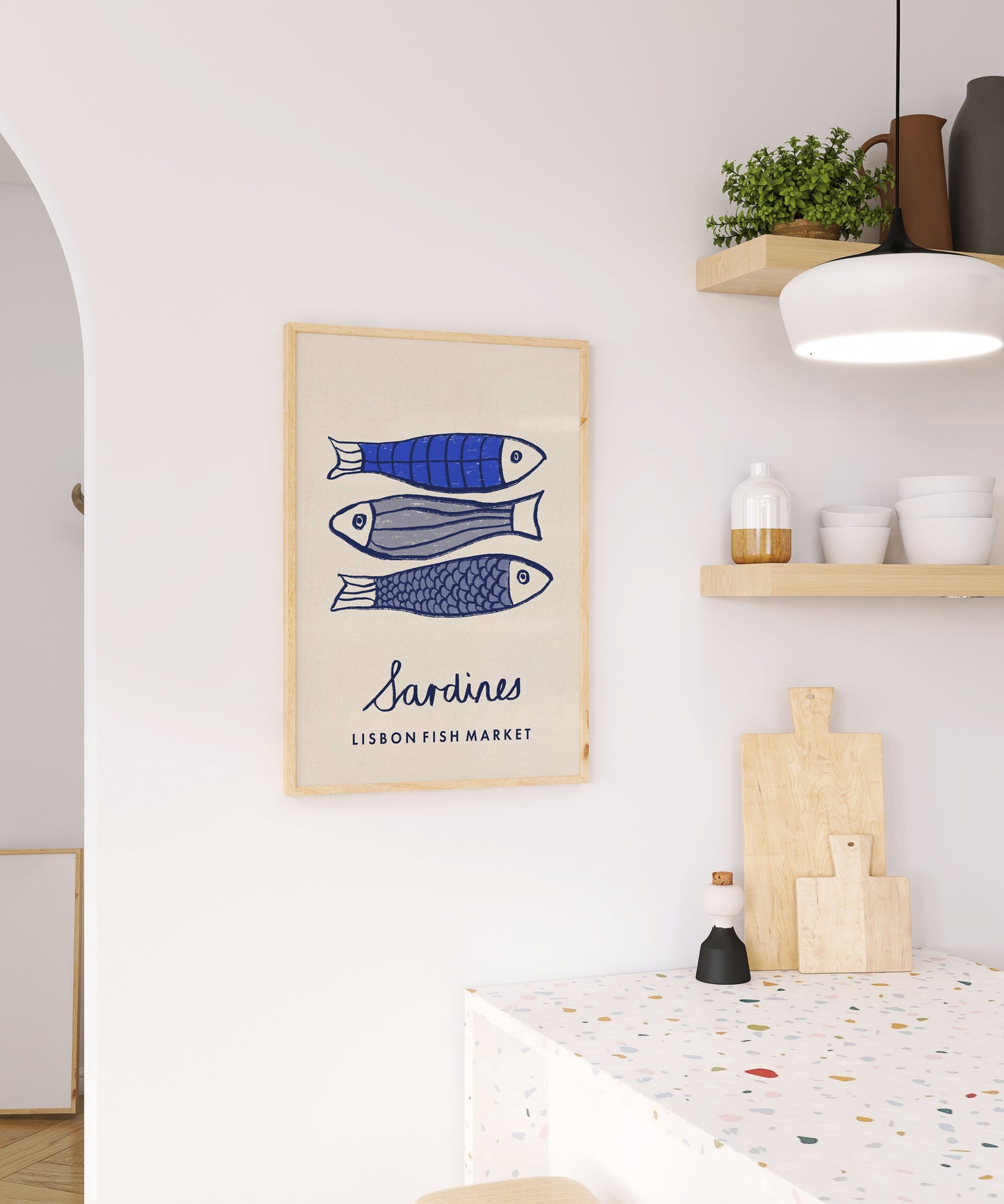 Framed artwork of fish on a wall in a kitchen setting