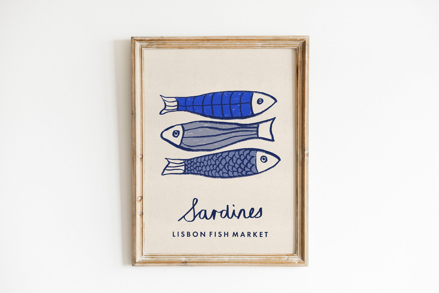 Framed artwork with illustrations of sardines and text 'Sardines Lisbon Fish Market' on a white background