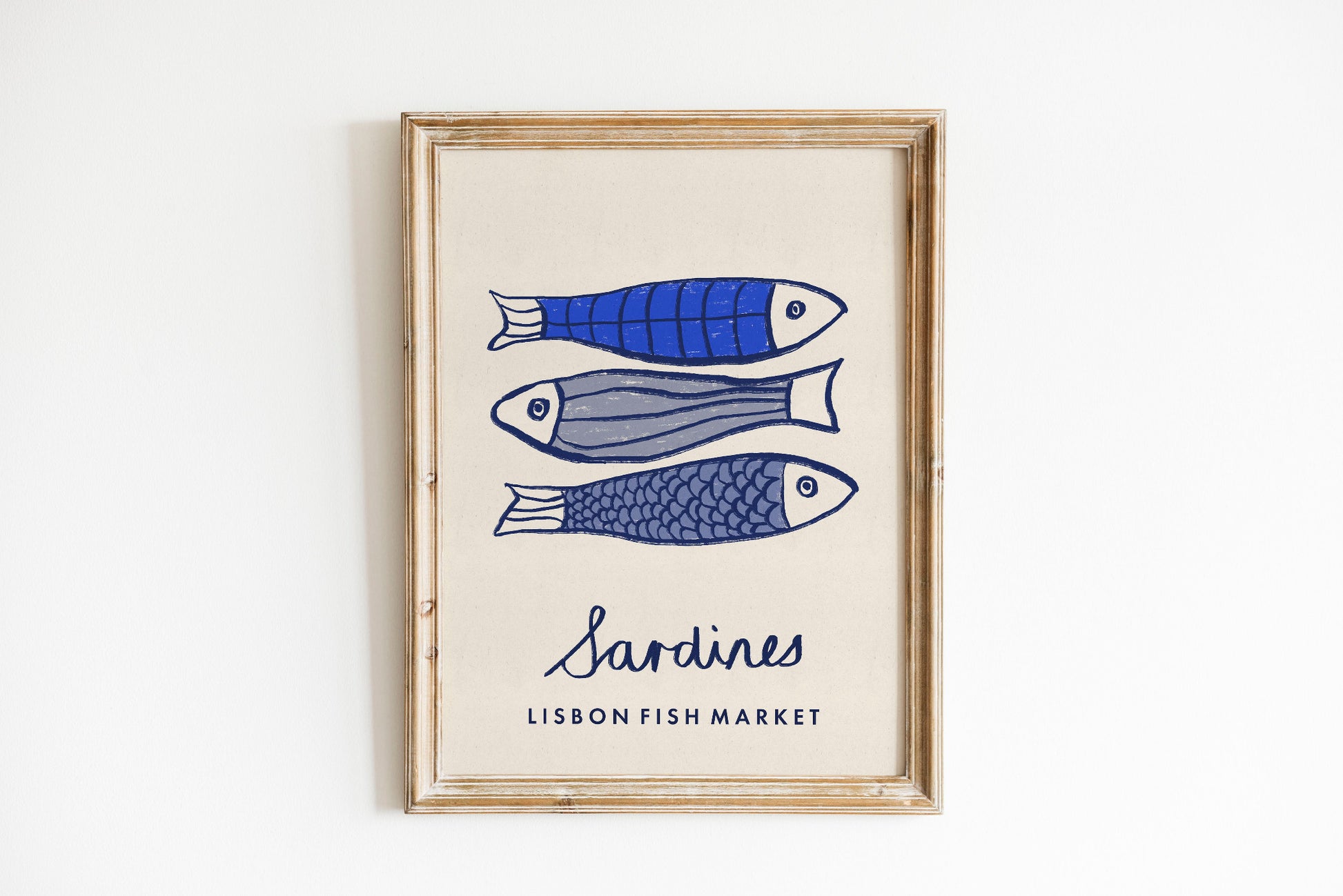 Framed artwork with illustrations of sardines and text 'Sardines Lisbon Fish Market' on a white background
