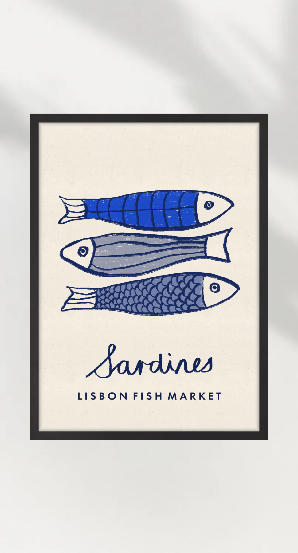Framed artwork of three stylized fish with 'Sardines Lisbon Fish Market' text on a white background.