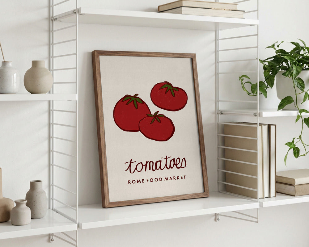 Framed print of tomatoes on a shelf with decorative items